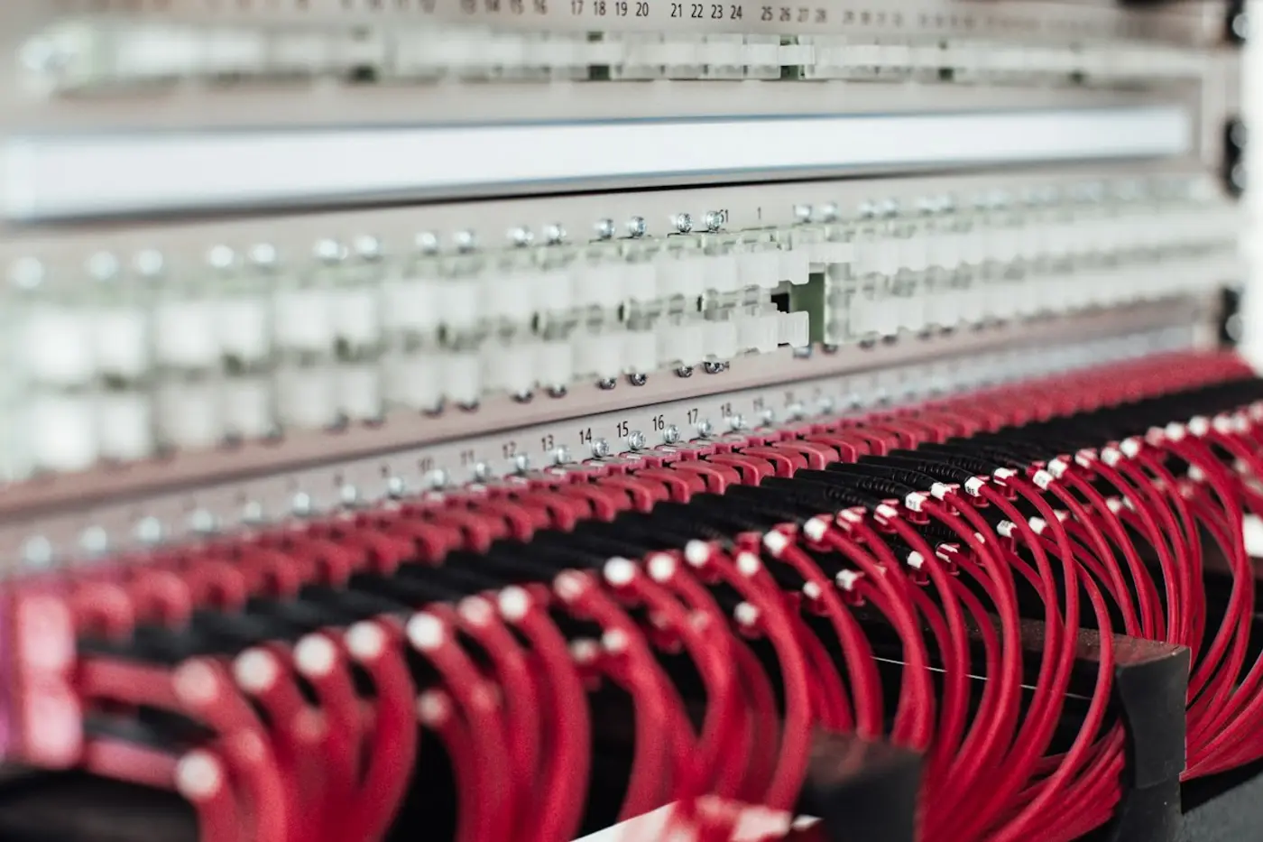 Patch panel with red network cables